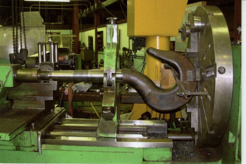 Machining the overhead cable hook forging