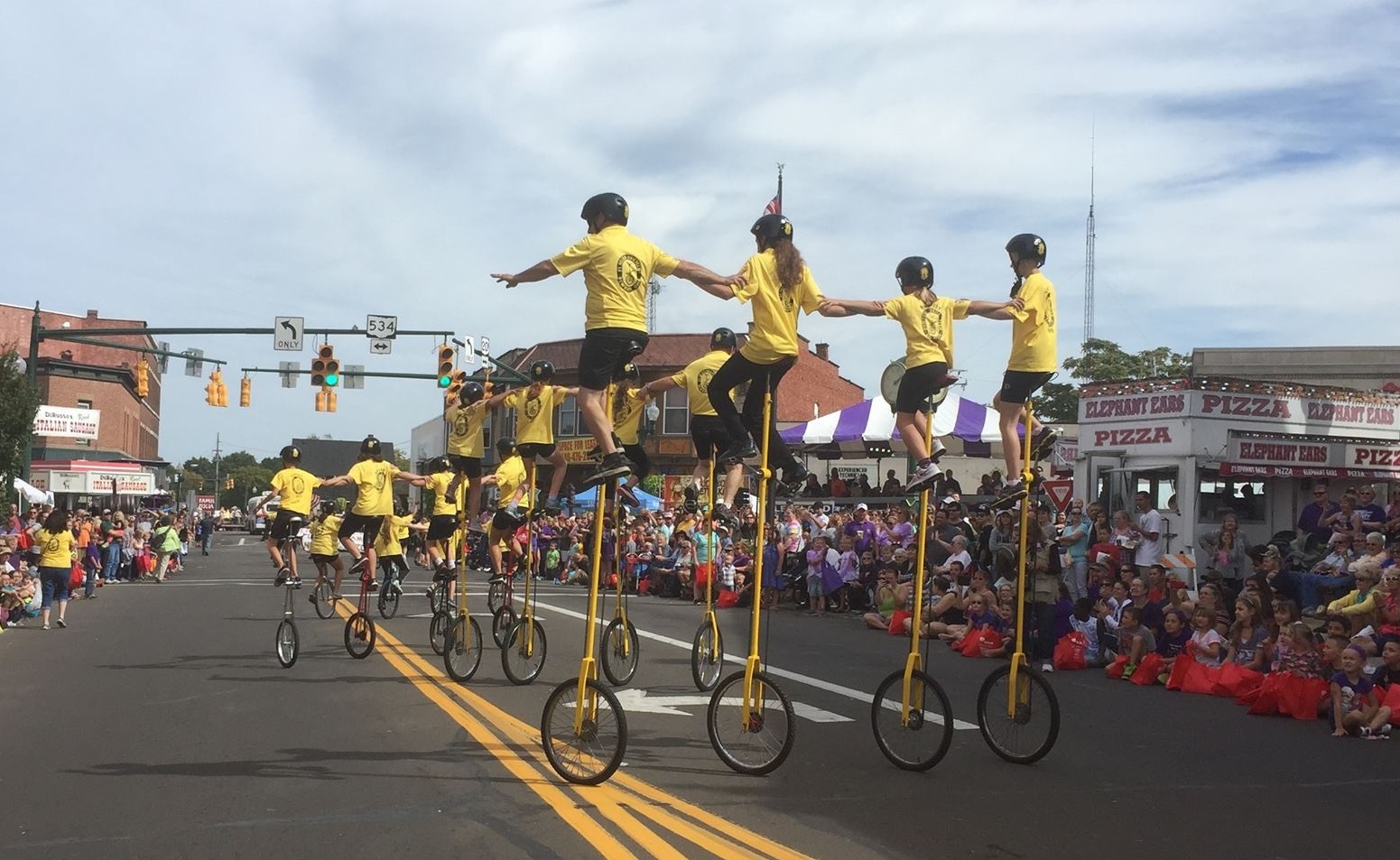 Members of the St. Helen Unicycle Drill Team in a parade