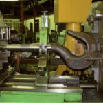 Machining the overhead cable hook forging